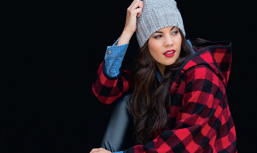 young white woman in flannel shirt and stocking cap