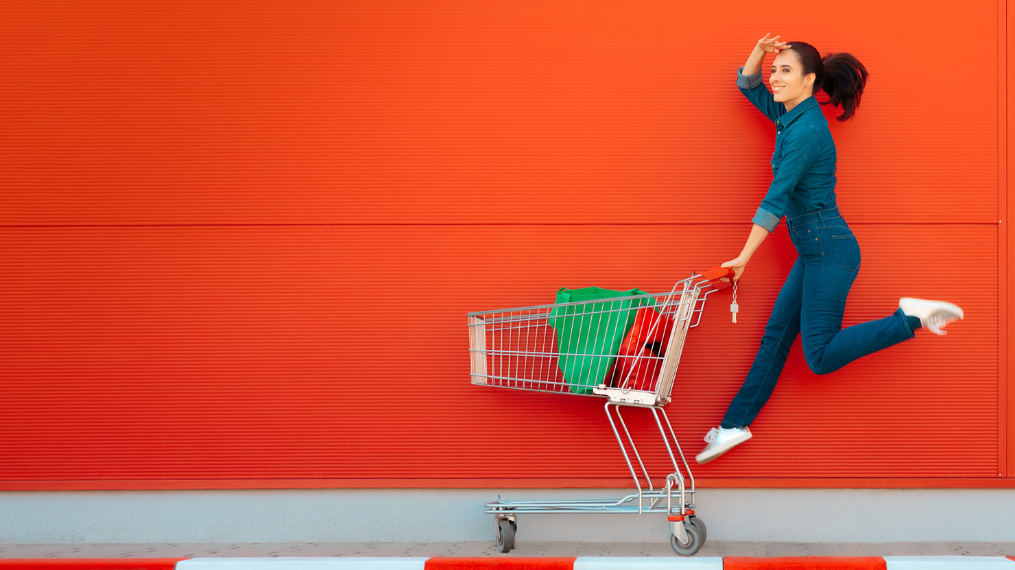 young white girl running behind her shopping cart