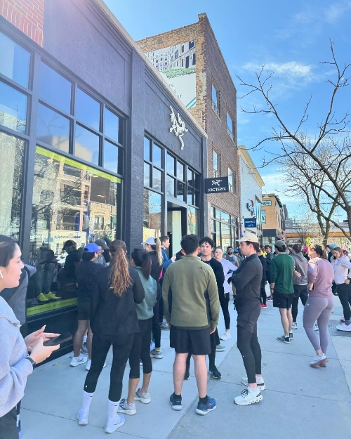 people waiting outside a store
