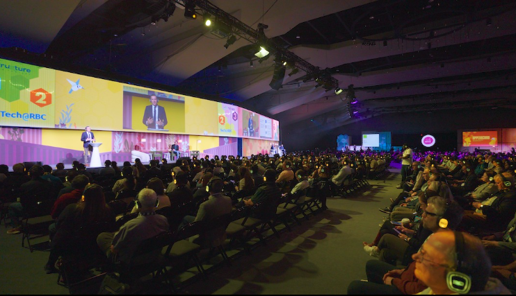an audience in front of a stage